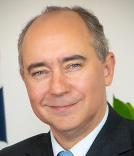 H.E. Lord Dominic Johnson